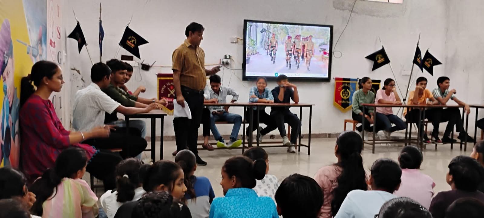 Students receiving medals and certificates during prize distribution ceremony at Royal Sainik School Parbatsar