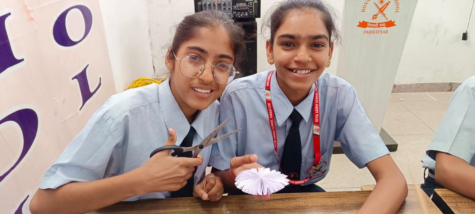 Students receiving medals and certificates during prize distribution ceremony at Royal Sainik School Parbatsar